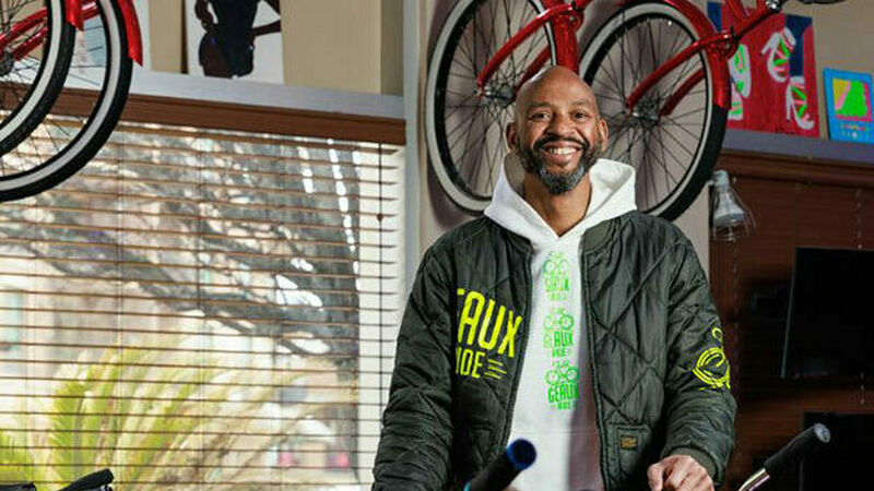 Charles Daniel HeadShot with bikes